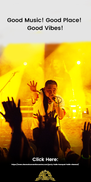 A Rock Singer At a Musical Concert Hosted In a Grand Banquet Hall With The Beautiful Yellow and Radiant Backlights