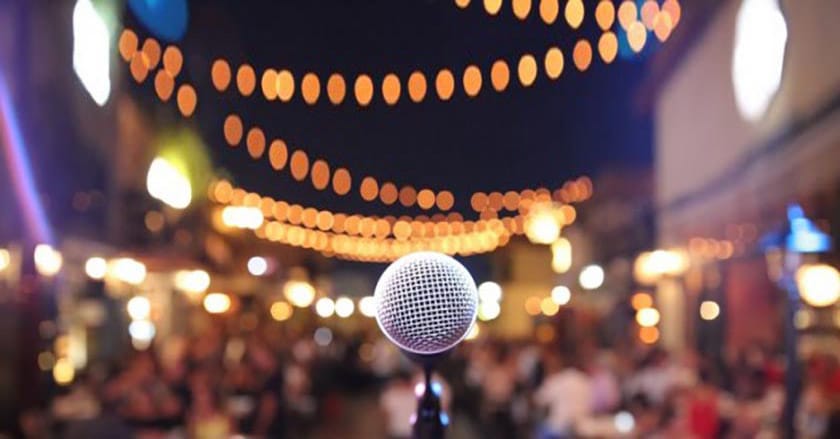 A Close-up view of microphone in a light background.